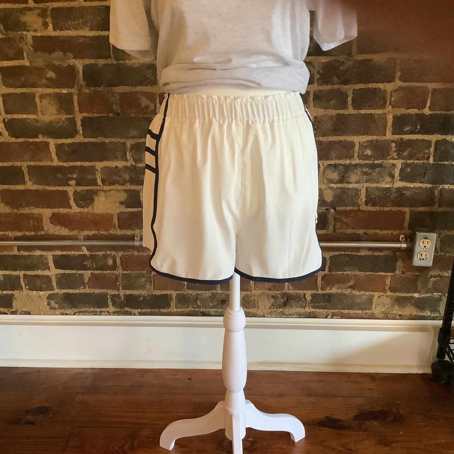 White pleated shorts